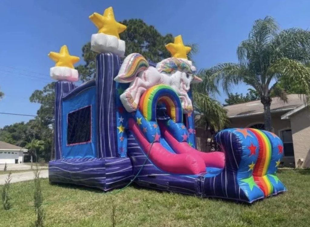 Colorful Unicorn Bounce House Rental in Lehigh Acres, FL with slide