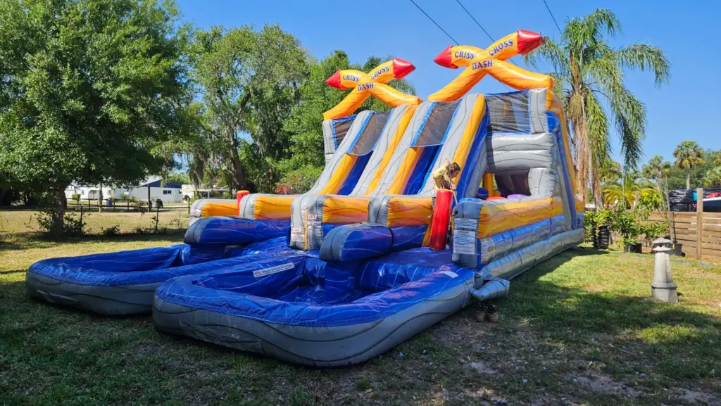 Large inflatable bounce house rental safely set up on grass in North Fort Myers, FL