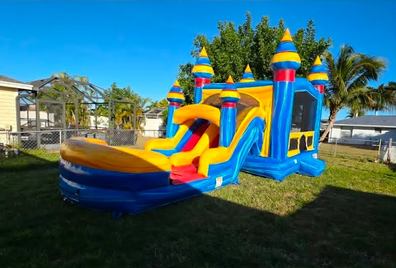 Cape Coral bounce house rental — blue and yellow inflatable combo with slide and splash pool set up in a Florida backyard