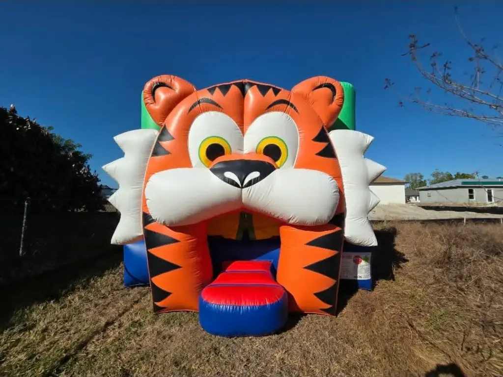 Bounce house rentals in Gateway — fun tiger-themed bounce house with walk-in mouth entrance
