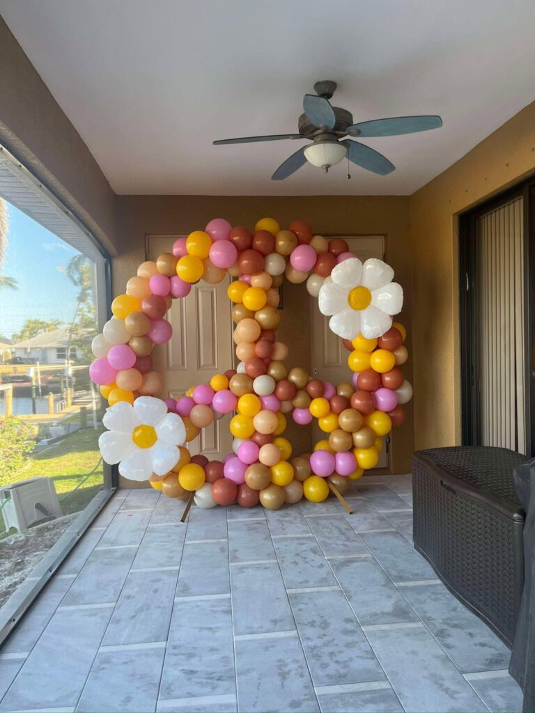 Daisy themed balloon hoop backdrop rental in Fort Myers Florida