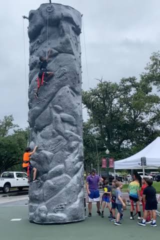 Family First Events & Rentals staffed rock wall rental for Fort Myers festivals and school events