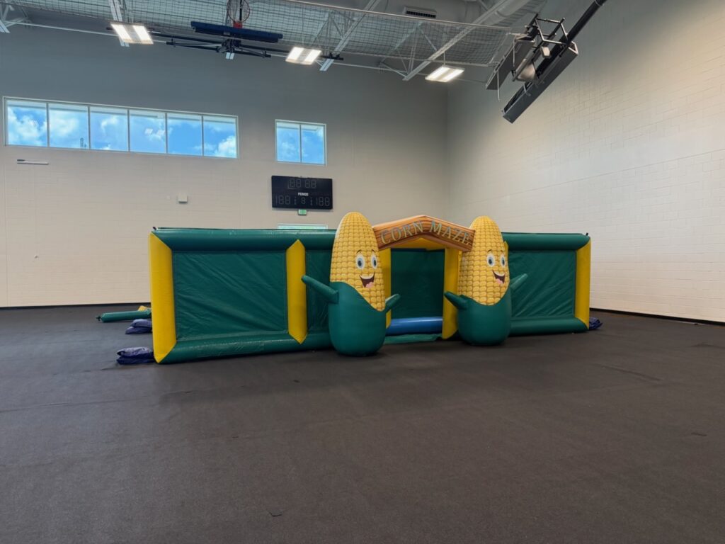 Corn Maze inflatable rental set up indoors by Family First Events & Rentals